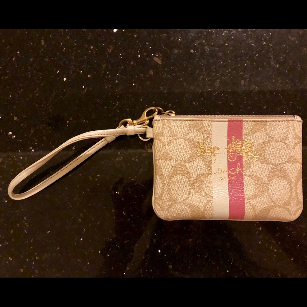 Tan Coach wristlet with c’s and pink